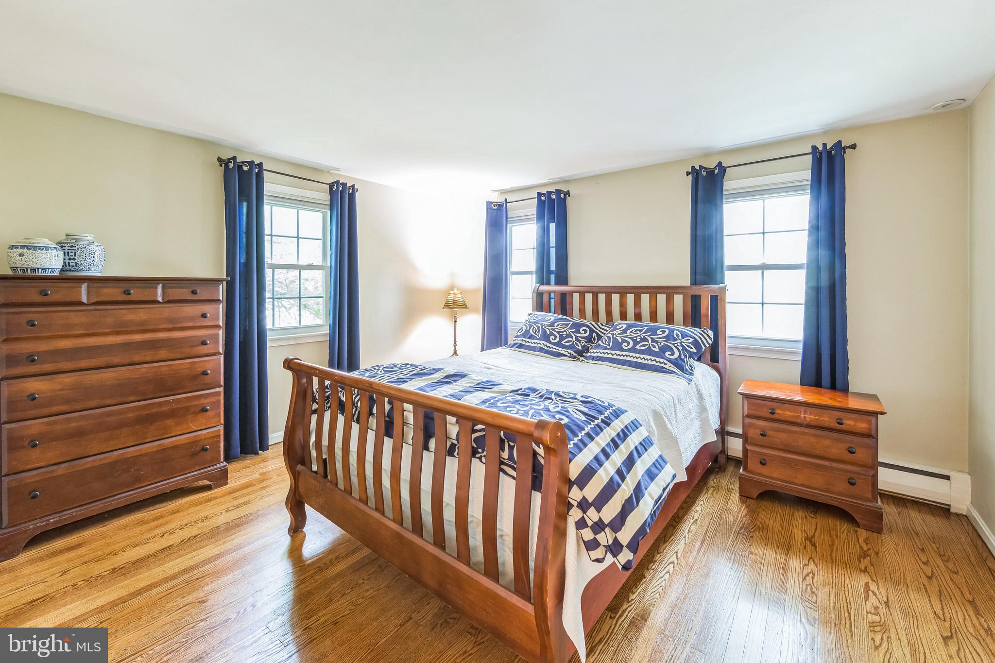 580 Gregory Lane Devon, PA 19333 - Photo 15 of 26 a bedroom with a bed and wooden floor