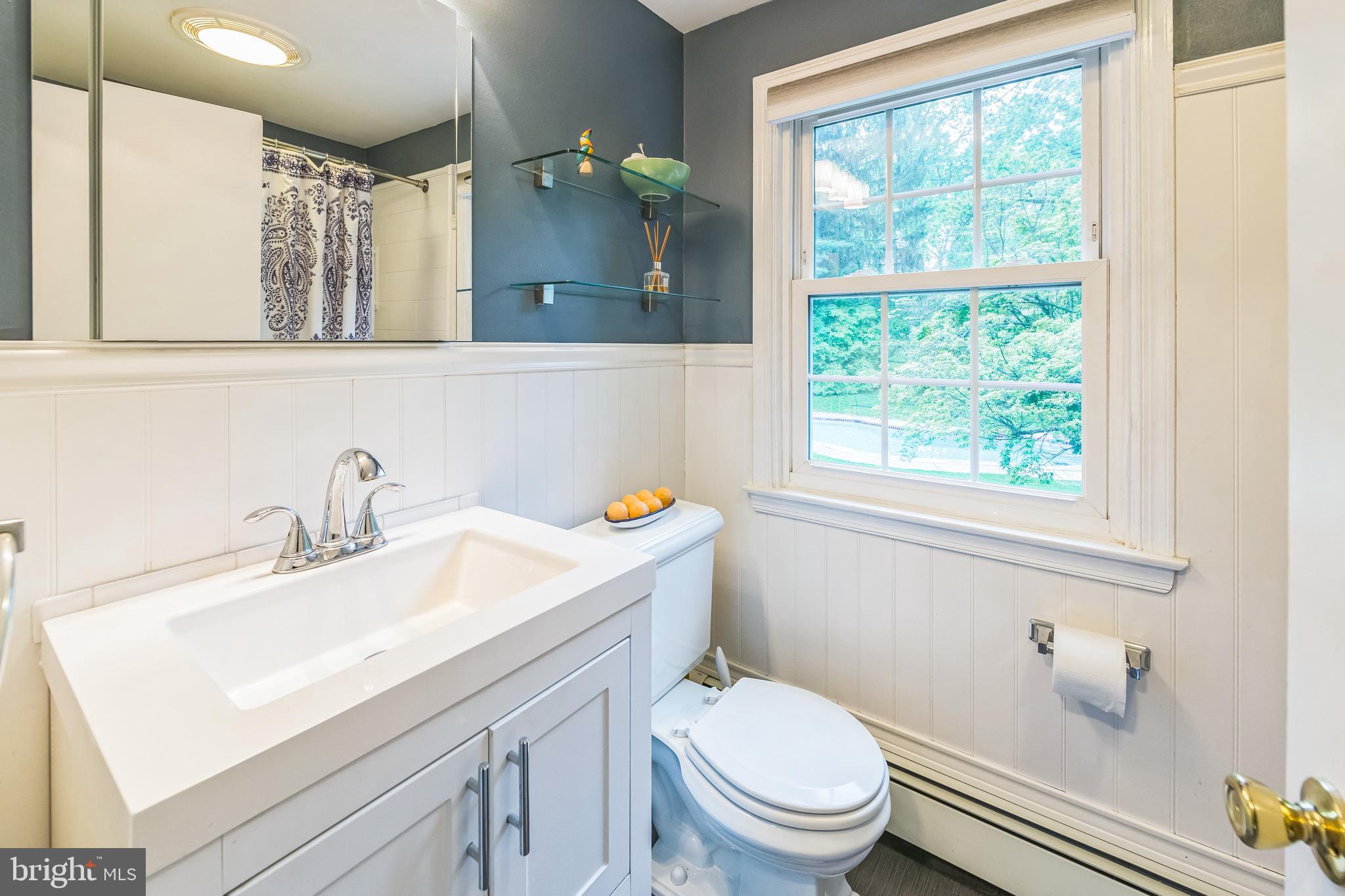 580 Gregory Lane Devon, PA 19333 - Photo 16 of 26 a bathroom with a sink a toilet and a window