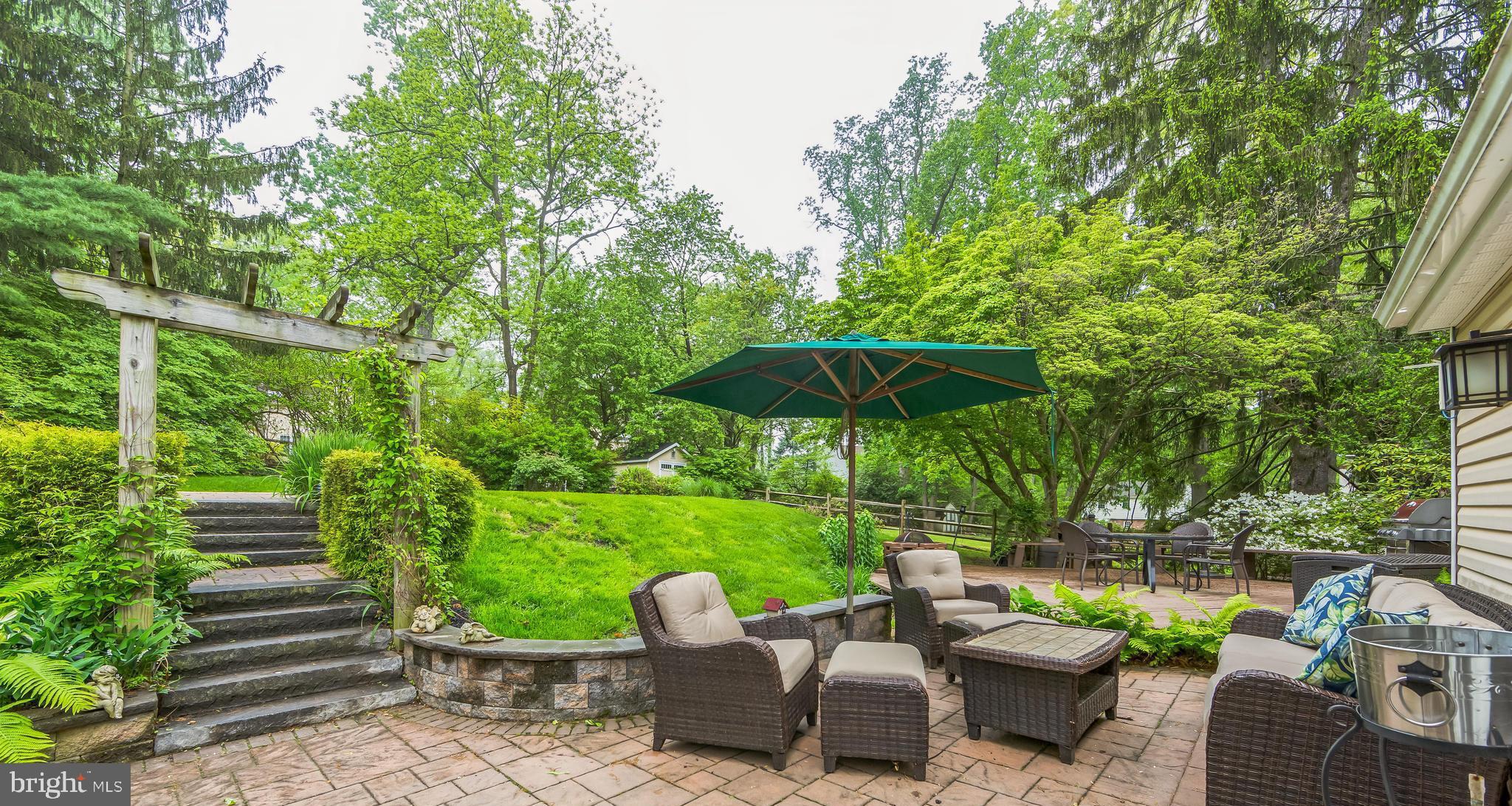 580 Gregory Lane Devon, PA 19333 - Photo 20 of 26 a view of a table and chairs under an umbrella