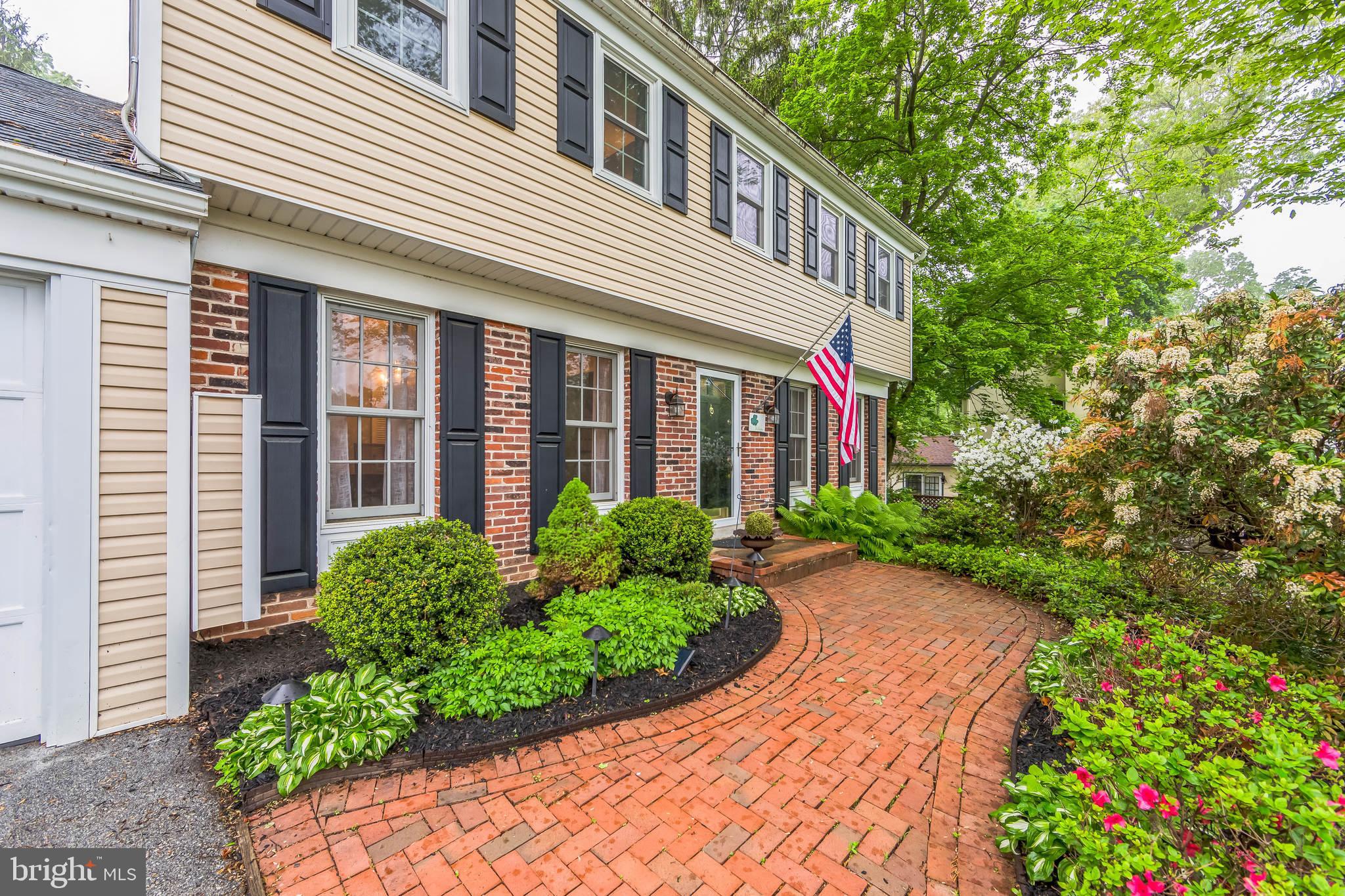 580 Gregory Lane Devon, PA 19333 - Photo 2 of 26 a front view of a house with garden