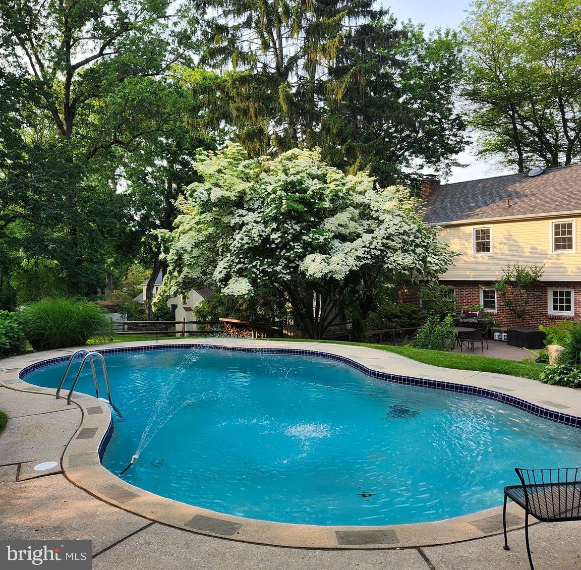580 Gregory Lane Devon, PA 19333 - Photo 23 of 26 a view of a swimming pool with lounge chair