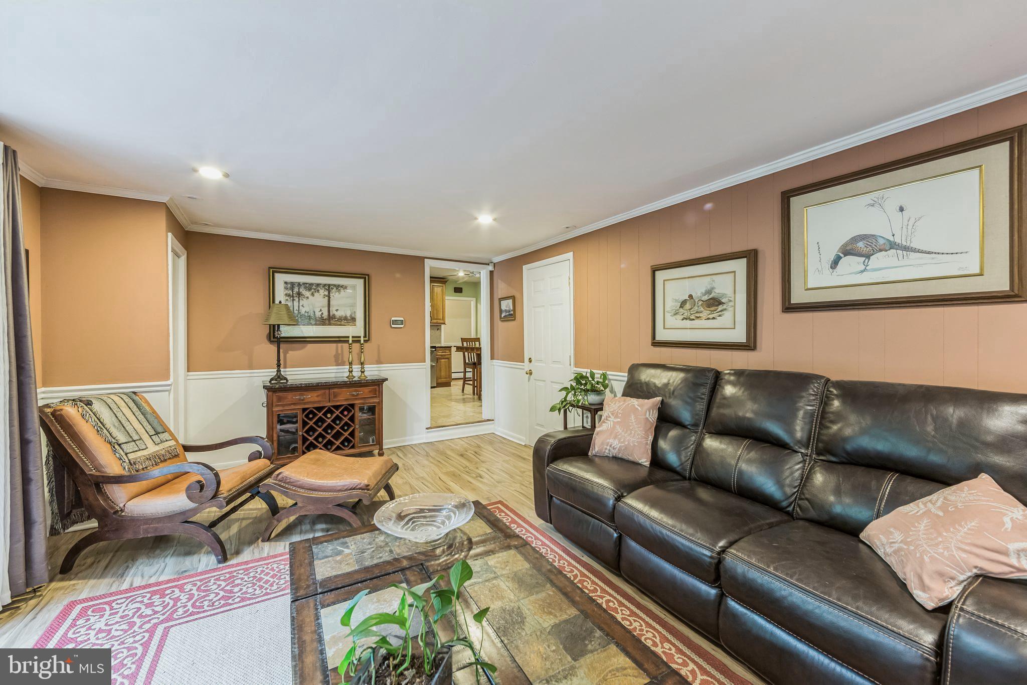 580 Gregory Lane Devon, PA 19333 - Photo 9 of 26 a living room with furniture and a painting
