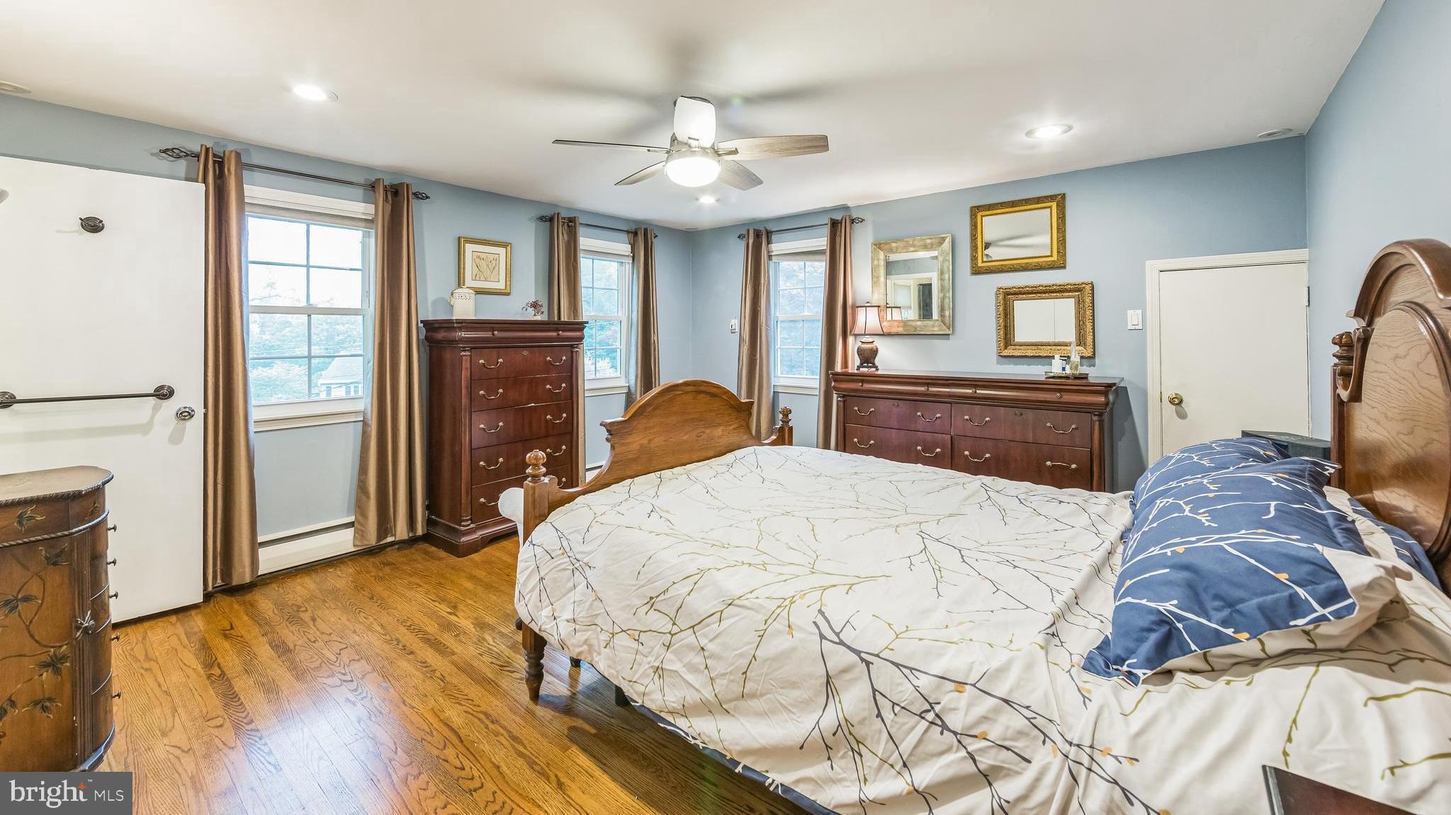 580 Gregory Lane Devon, PA 19333 - Photo 10 of 26 a bedroom with a bed dresser and a large window