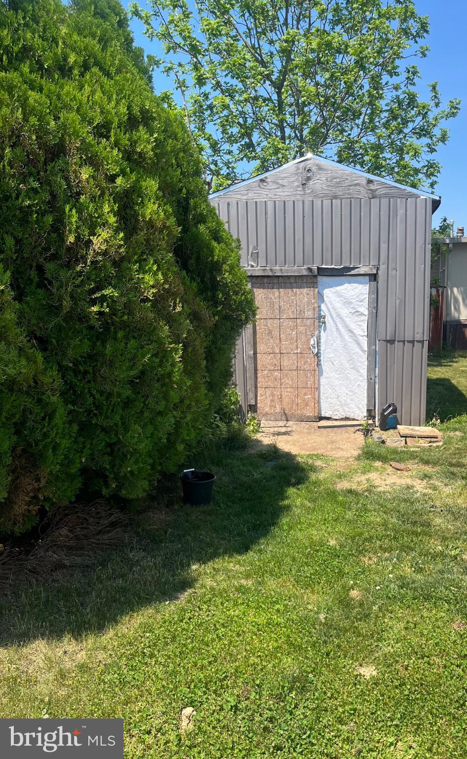 4191 Lake Road, Unit 25 Newfield, NJ 08344 - Photo 4 of 12 Charming shed nestled in greenery.