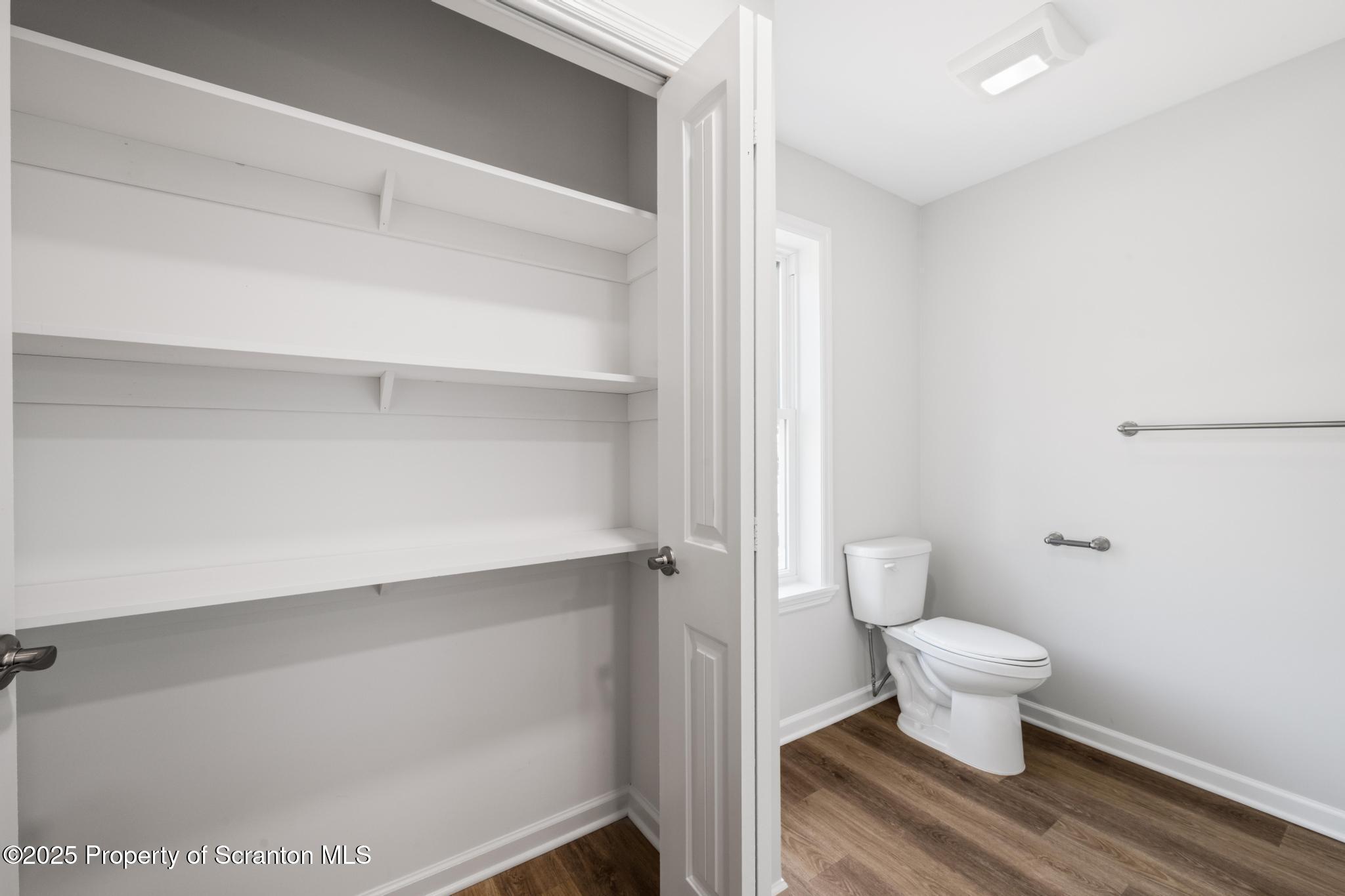 45 Zackery Way Old Forge, PA 18518 - Photo 19 of 26 a bathroom with a toilet and a mirror