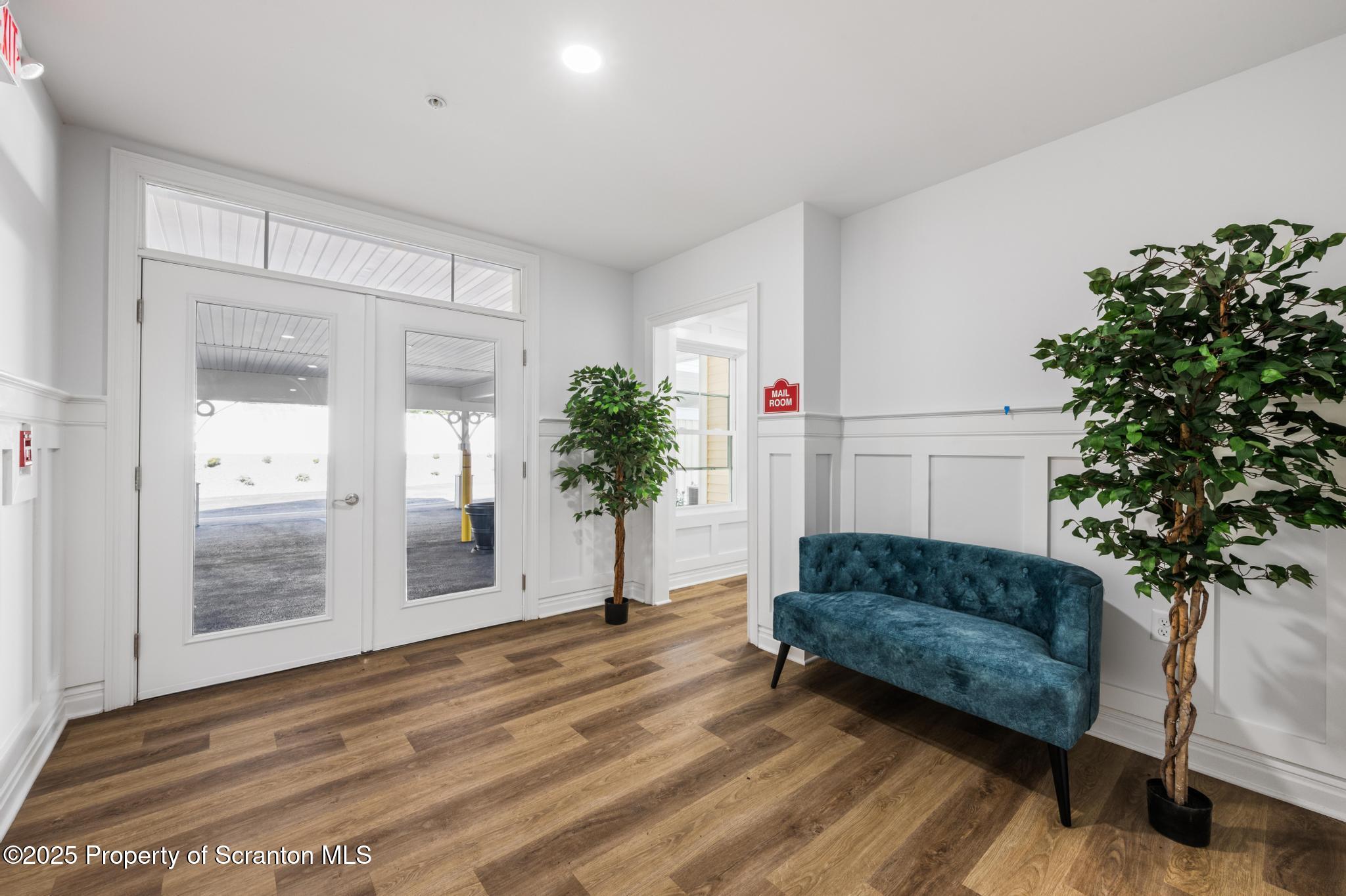45 Zackery Way Old Forge, PA 18518 - Photo 5 of 26 a living room with furniture and a potted plant
