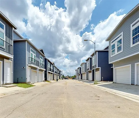 a view of a building with a snow on the road