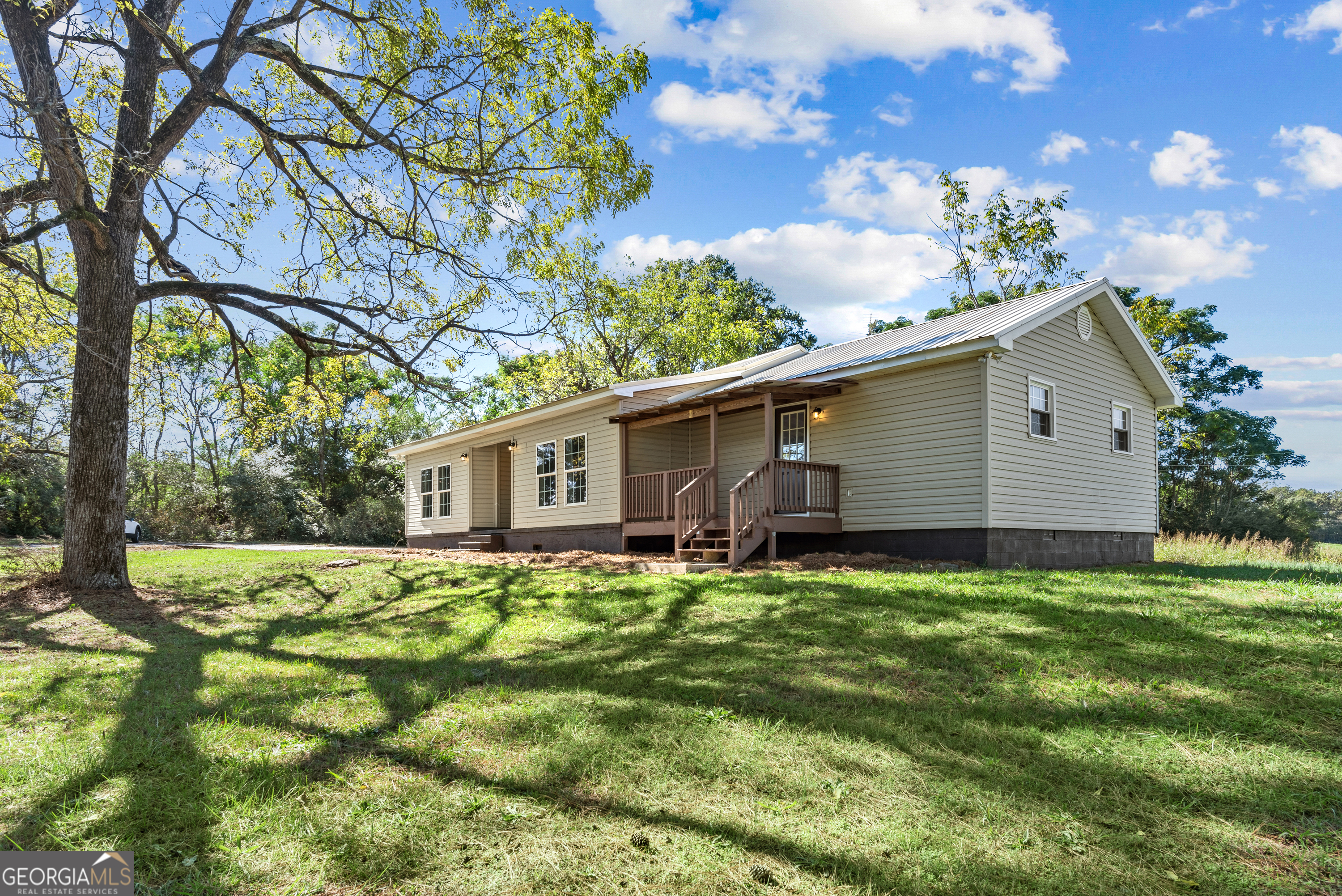 2058 Wildcat Bridge Road Royston, GA 30662 - Photo 1 of 1 a backyard of a house with lots of green space