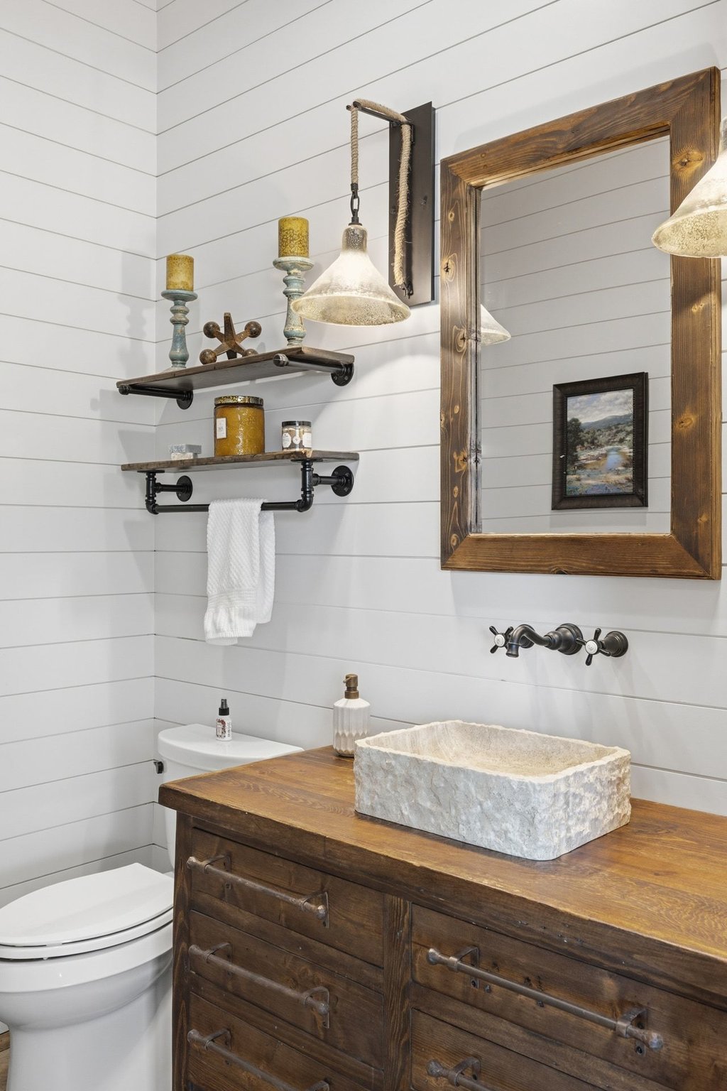1660 Windmill Run Wimberley, TX 78676 - Photo 24 of 40 a bathroom with a granite countertop sink toilet and mirror
