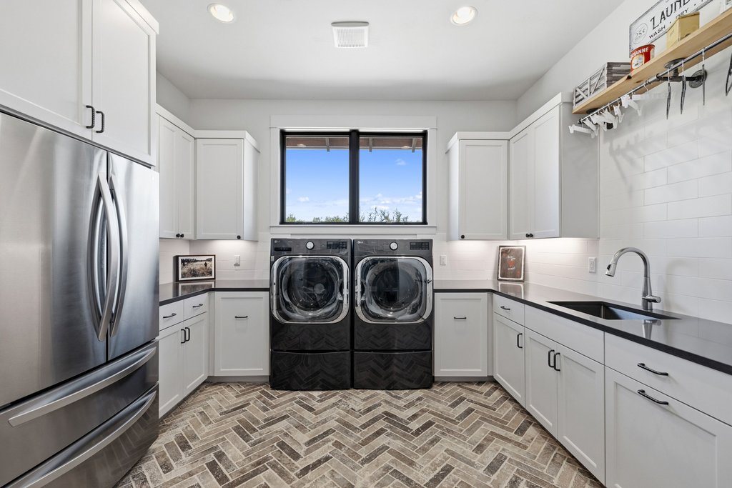 1660 Windmill Run Wimberley, TX 78676 - Photo 38 of 40 a kitchen with a sink stove and refrigerator