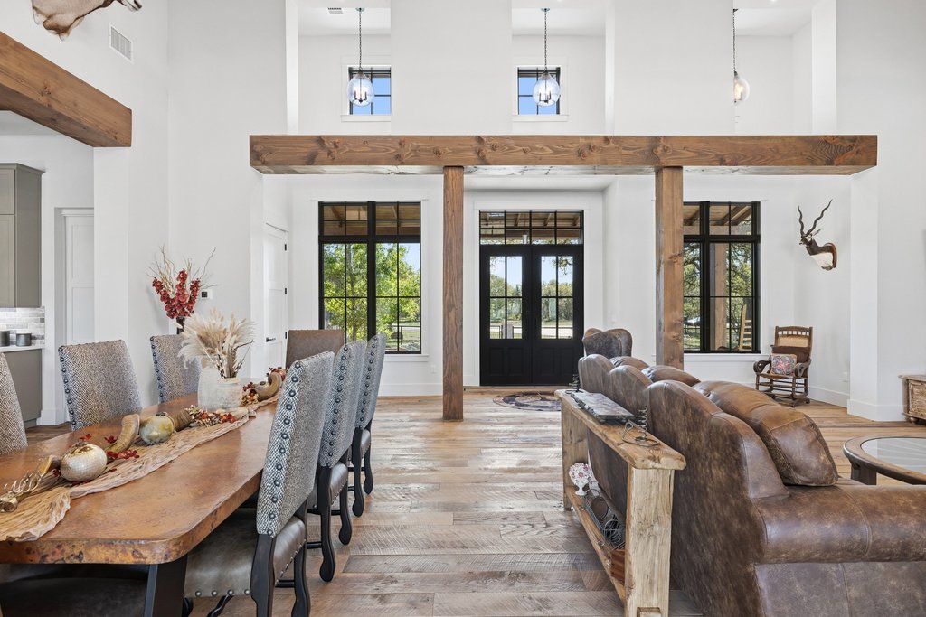 1660 Windmill Run Wimberley, TX 78676 - Photo 6 of 40 a living room with furniture and wooden floor