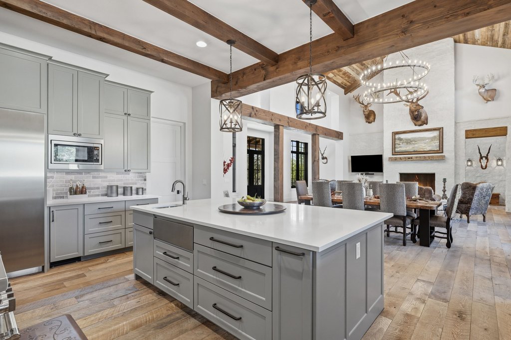 1660 Windmill Run Wimberley, TX 78676 - Photo 40 of 40 a kitchen with stainless steel appliances granite countertop a sink and cabinets