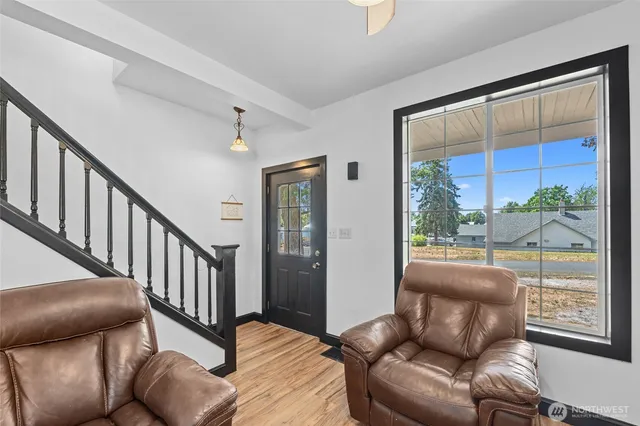 a living room with furniture and a window