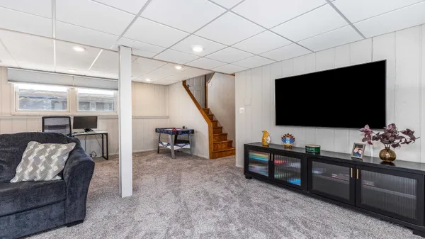 a living room with furniture and a flat screen tv