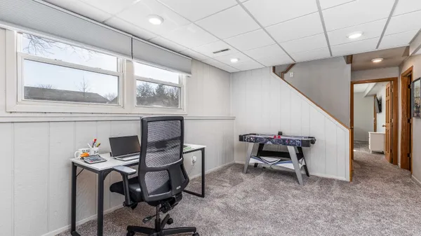 a view of a workspace with furniture