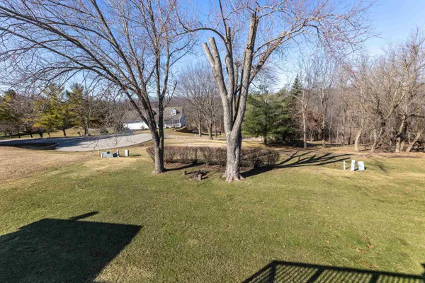 a view of swimming pool with outdoor seating and yard