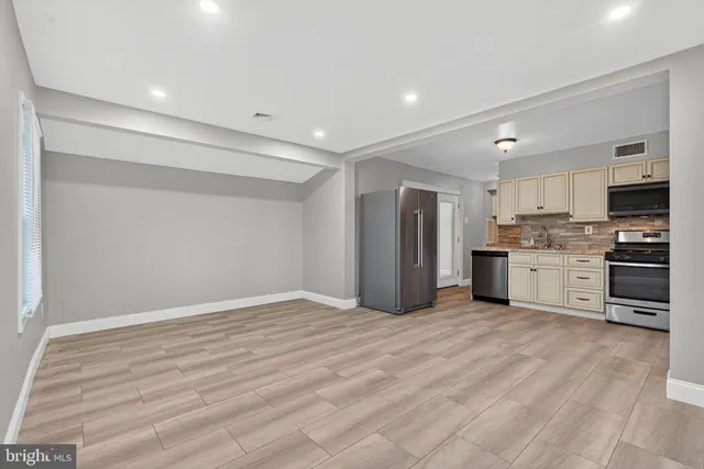 a view of kitchen with wooden floor