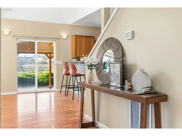 a view of a hardwood floor and dining room