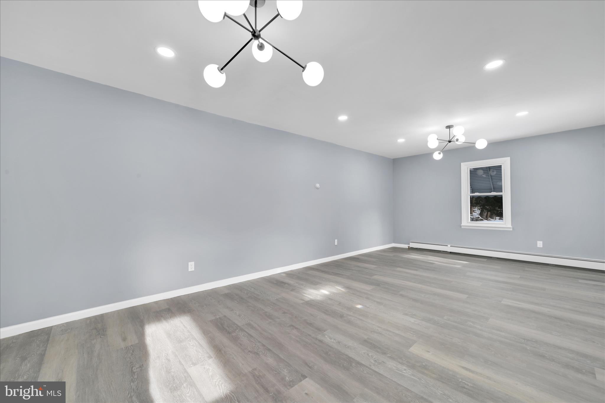 2 Edgar Lewis Street Minersville, PA 17954 - Photo 12 of 29 an empty room with wooden floor and windows