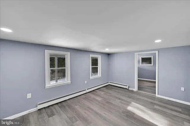 a large kitchen with stainless steel appliances granite countertop a stove and a refrigerator