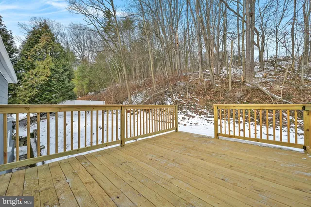 a view of a balcony with wooden floor