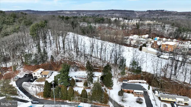 a view of a balcony with yard