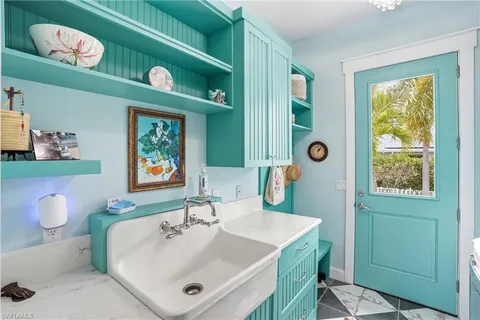 a view of a storage and utility room with a washer dryer