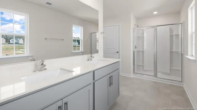 a bathroom with a sink toilet and a mirror