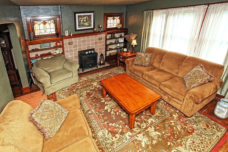 233 Friday Road Pittsburgh, PA 15209 - Photo 3 of 21 Living room featuring hardwood flooring and stained glass windows
