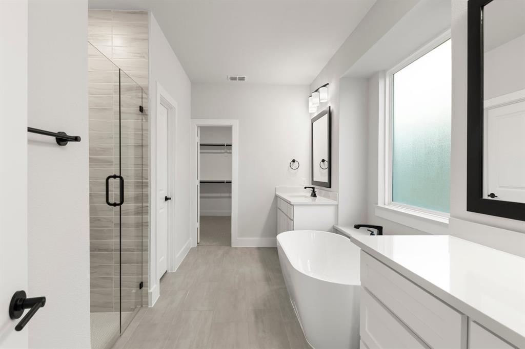 13709 Riola Drive Little Elm, TX 75068 - Photo 17 of 40 a bathroom with a sink a toilet and shower