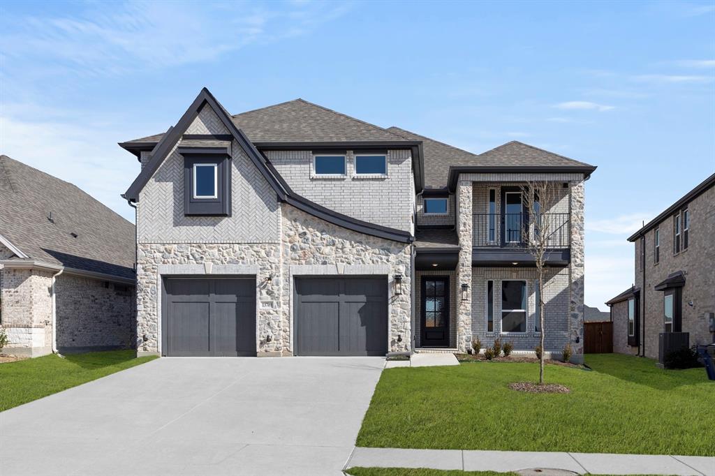 13709 Riola Drive Little Elm, TX 75068 - Photo 2 of 40 a front view of a house with a yard and garage