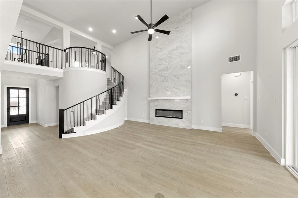 13709 Riola Drive Little Elm, TX 75068 - Photo 24 of 40 a view of an entryway with a chandelier