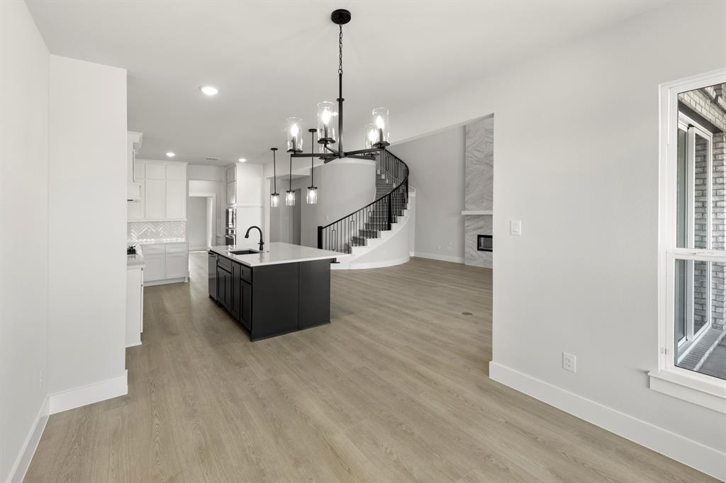 13709 Riola Drive Little Elm, TX 75068 - Photo 25 of 40 a view of a living room and kitchen with a sink