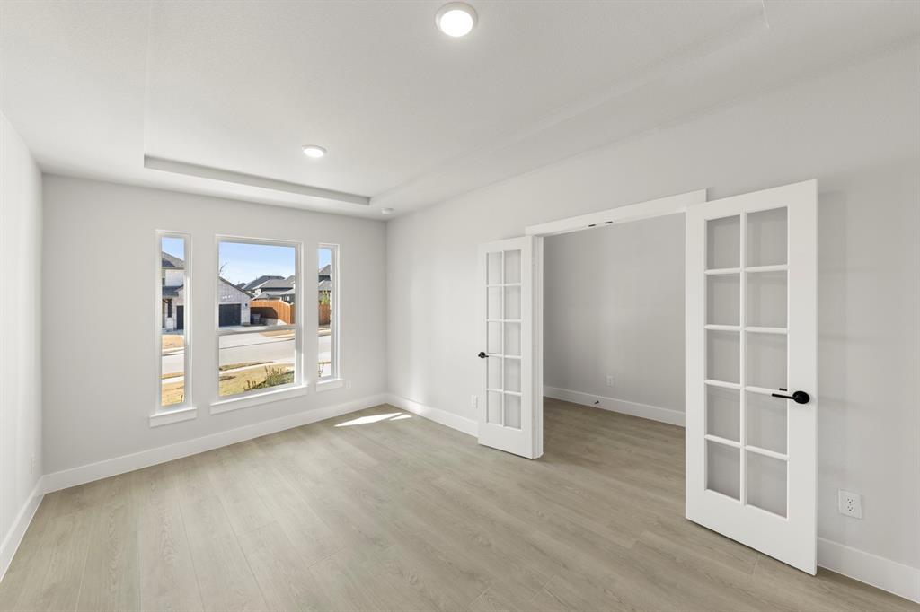 13709 Riola Drive Little Elm, TX 75068 - Photo 26 of 40 an empty room with windows