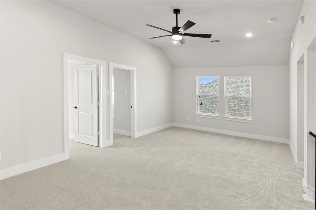 13709 Riola Drive Little Elm, TX 75068 - Photo 34 of 40 an empty room with fan and windows