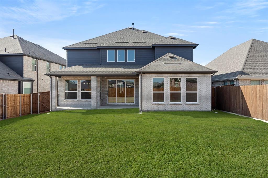 13709 Riola Drive Little Elm, TX 75068 - Photo 39 of 40 a front view of a house with a garden
