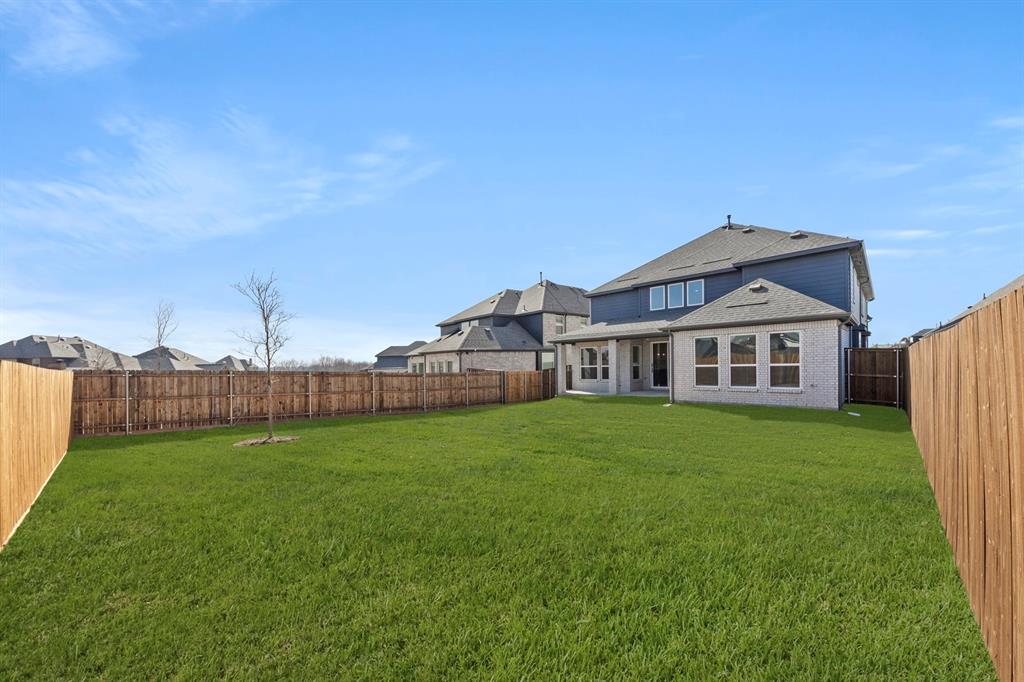 13709 Riola Drive Little Elm, TX 75068 - Photo 40 of 40 a house view with a garden space