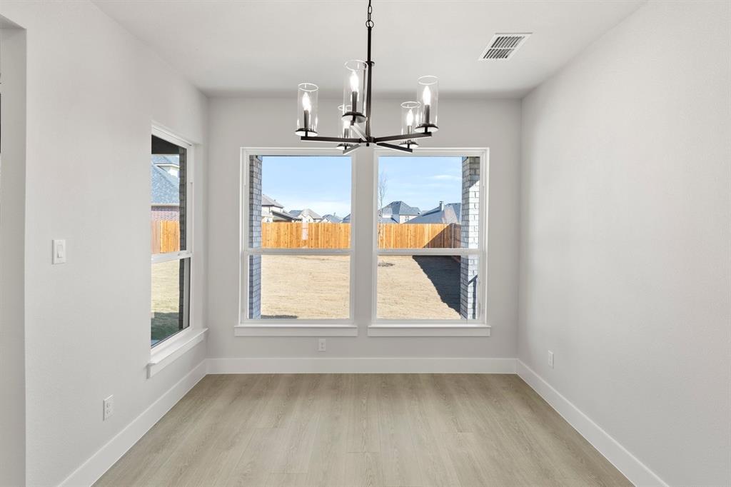 13709 Riola Drive Little Elm, TX 75068 - Photo 10 of 40 a view of an empty room with a window