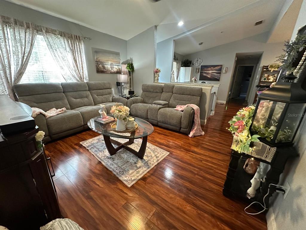 875 Grand Regency Pointe, Unit 203 Altamonte Springs, FL 32714 - Photo 11 of 17 a living room with furniture rug and window