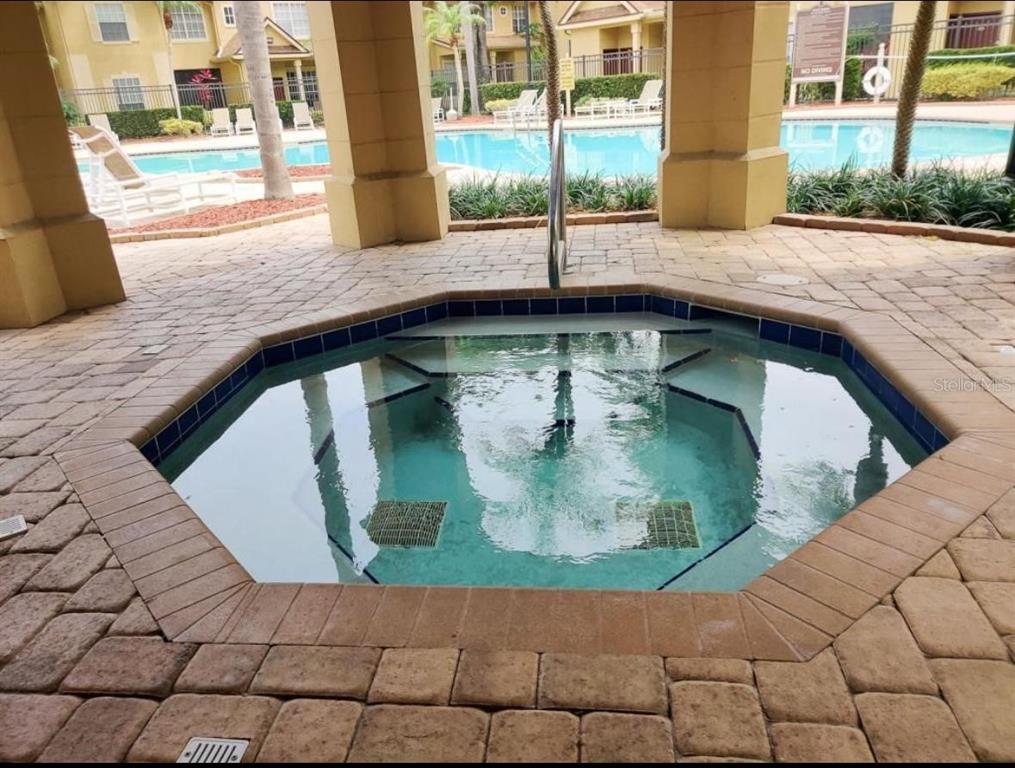 875 Grand Regency Pointe, Unit 203 Altamonte Springs, FL 32714 - Photo 12 of 17 a view of a wooden floor and a potted plant