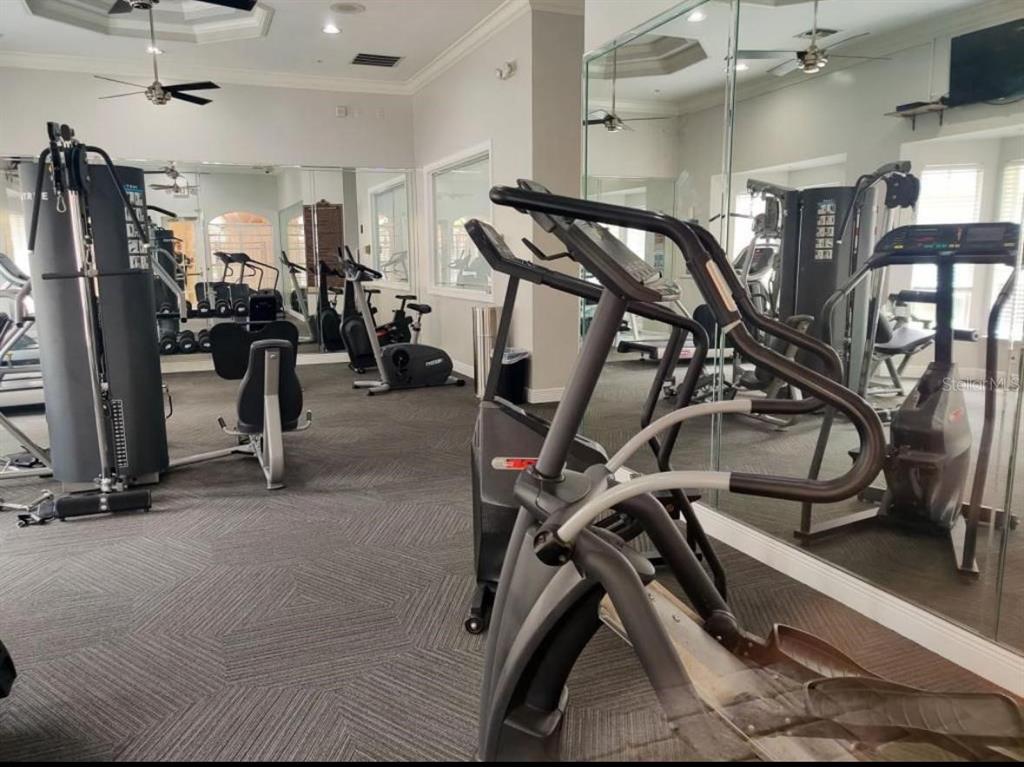 875 Grand Regency Pointe, Unit 203 Altamonte Springs, FL 32714 - Photo 14 of 17 a view of a room with gym equipment