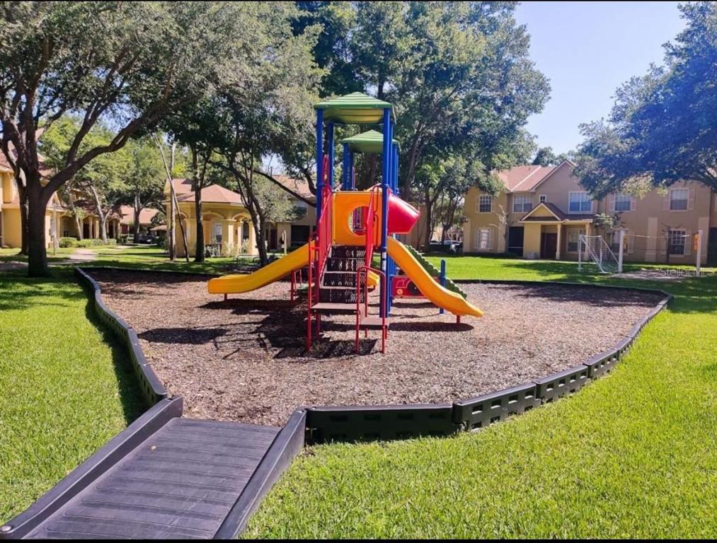875 Grand Regency Pointe, Unit 203 Altamonte Springs, FL 32714 - Photo 15 of 17 a view of outdoor space with garden and entertaining space