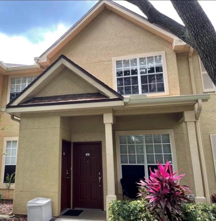 875 Grand Regency Pointe, Unit 203 Altamonte Springs, FL 32714 - Photo 17 of 17 a front view of a house with a yard