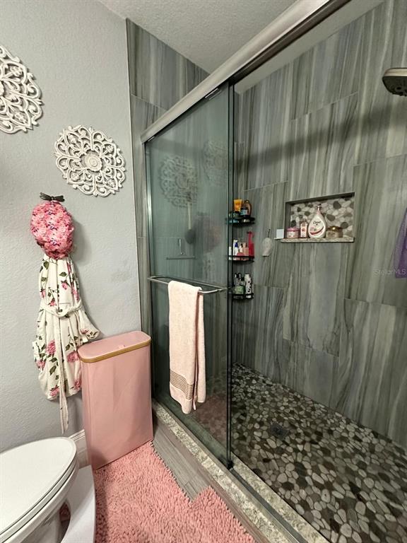 875 Grand Regency Pointe, Unit 203 Altamonte Springs, FL 32714 - Photo 7 of 17 a bathroom with a sink toilet and shower