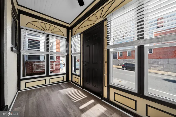 a view of a balcony with wooden floor