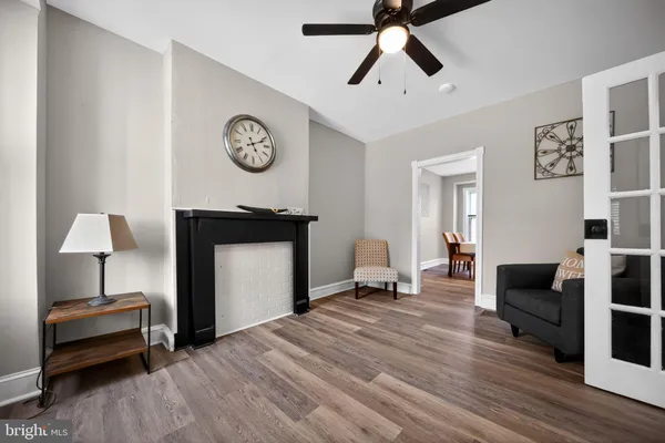 a bedroom with furniture and a mirror