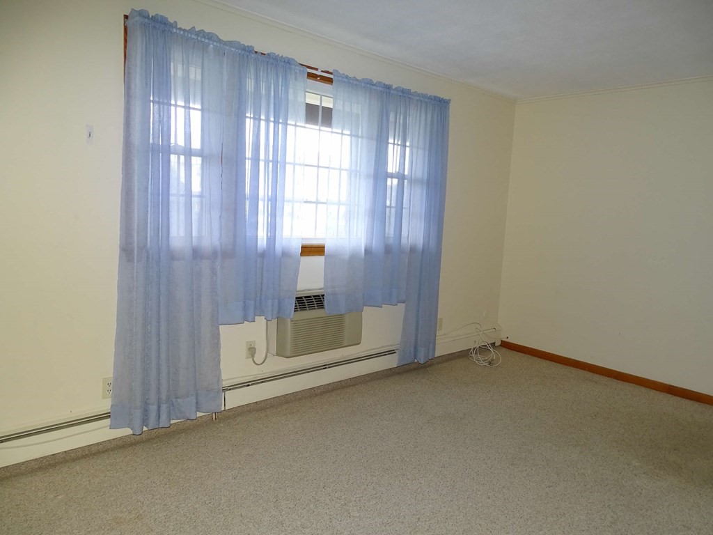 166 Upper County Road, Unit 16 Dennis, MA 02639 - Photo 3 of 7 an empty room with a window