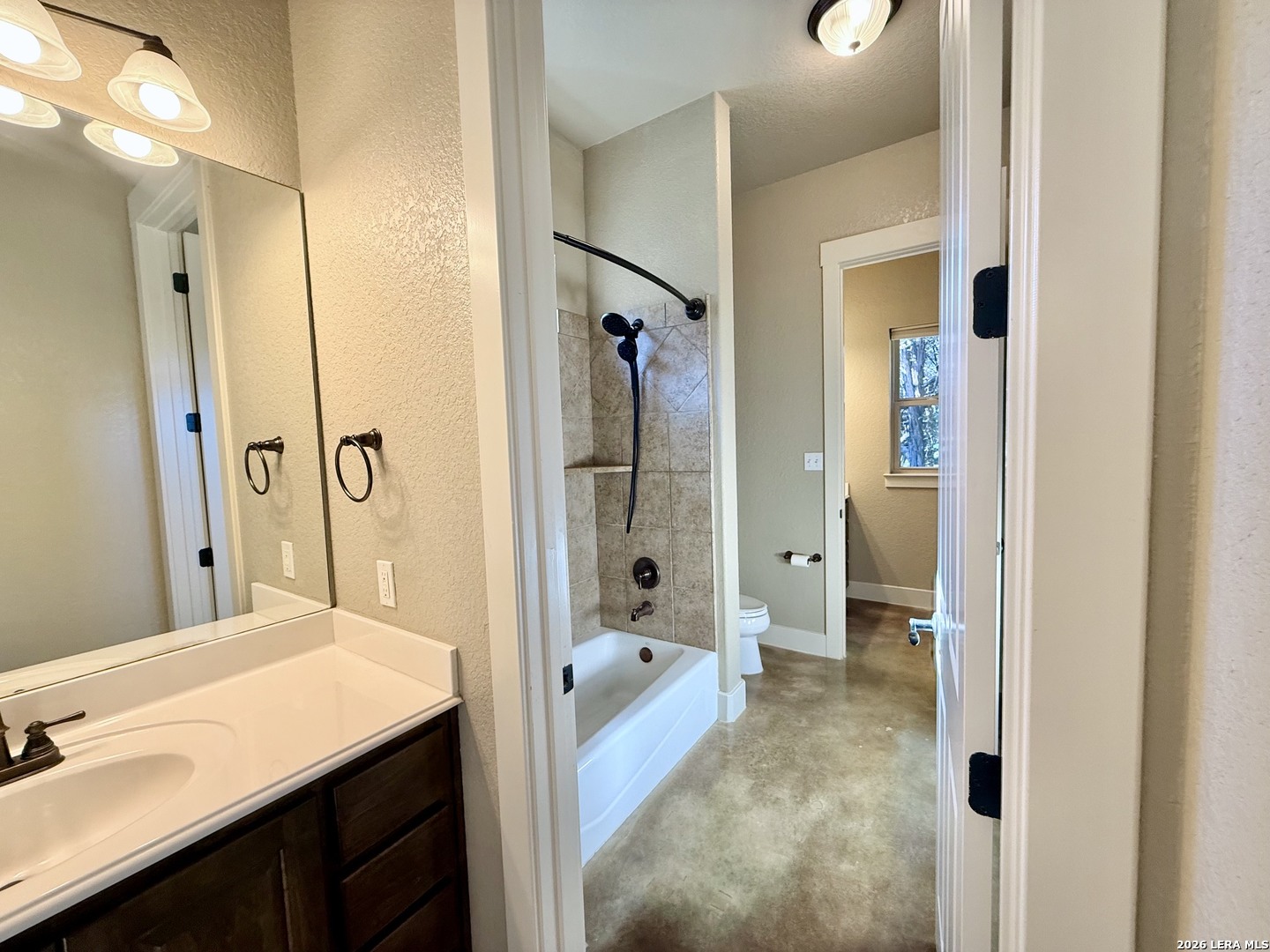 757 Copper Rim Spring Branch, TX 78070 - Photo 29 of 50 a spacious bathroom with a shower sink and a mirror