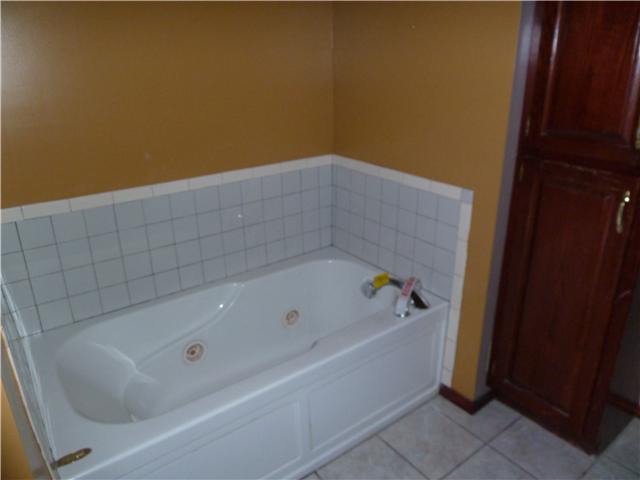 1820 Limestone Road Elora, TN 37328 - Photo 13 of 14 a bathroom with a bathtub