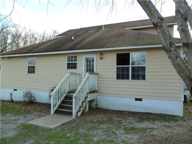 1820 Limestone Road Elora, TN 37328 - Photo 5 of 14 a view of a house with a backyard